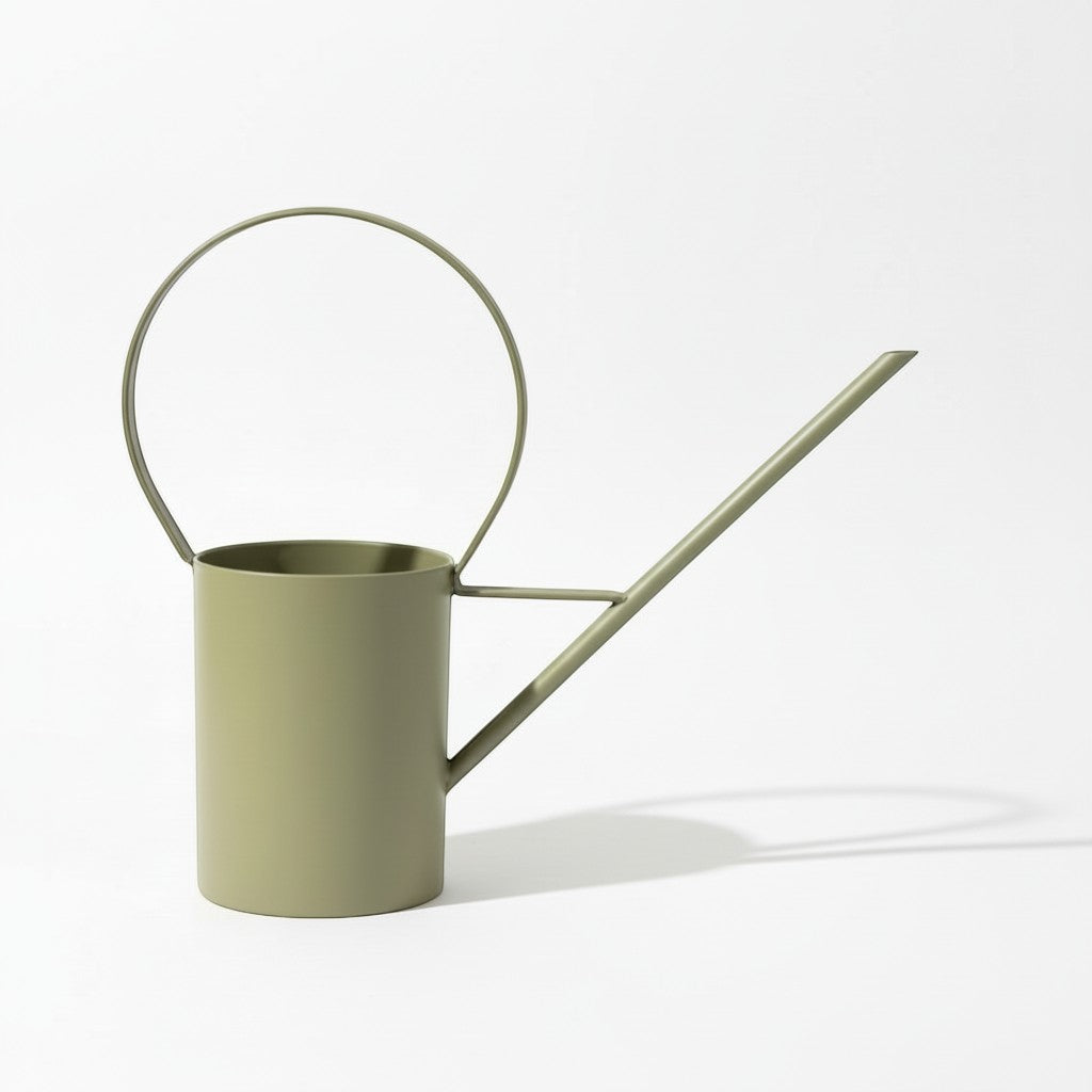 Simple Home Pennsylvania 10" decorative sage green metal watering can with a large loop handle and a bouquet of pink flowers.